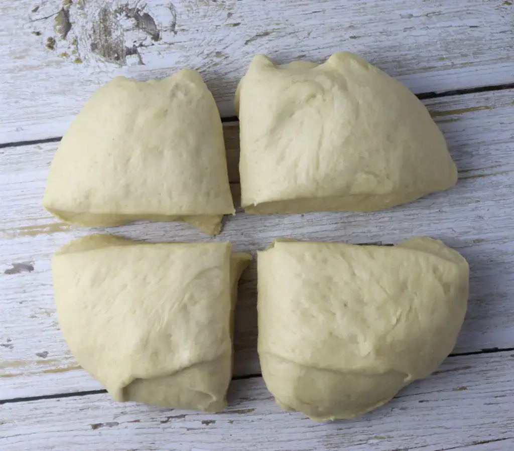 diving the dough balls into four pieces
