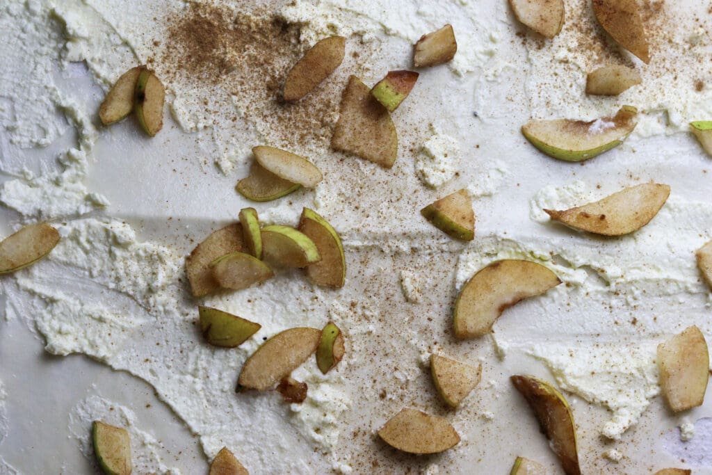 Homemade phyllo pear strudel filling generously sprinkled with cinnamon. 