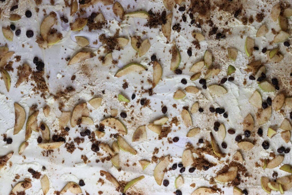 Adding breadcrumbs to pear strudel homemade phyllo filling. 