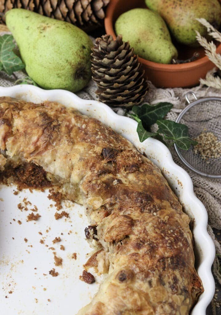 A baking sheet with pear strudel getting quickly empty. 