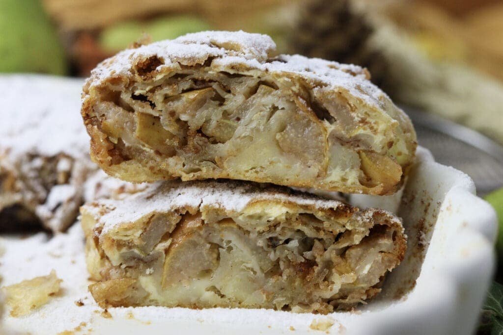 Two large slices of delicious pear cheese strudel.