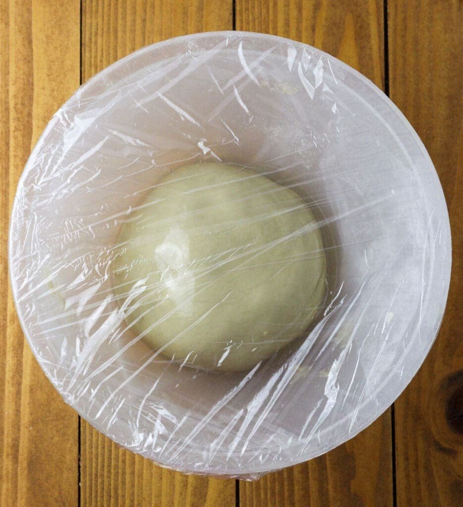 Resting the strudel dough ball in a bowl, covered with plastic foil. 