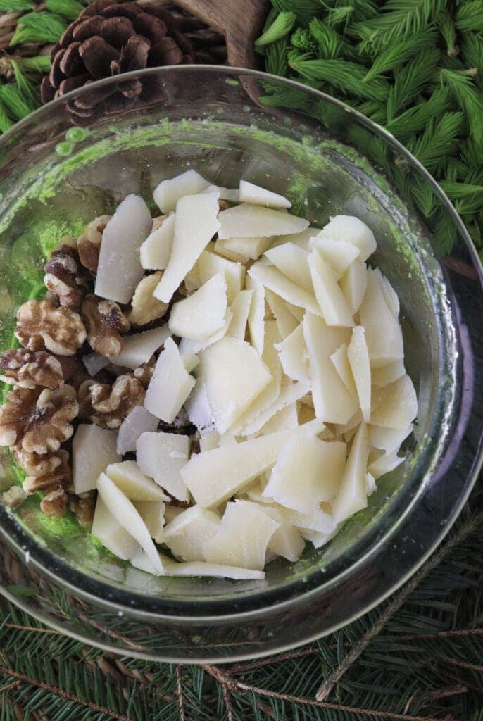 Image showing how to blend in parmesan cheese and walnuts. 