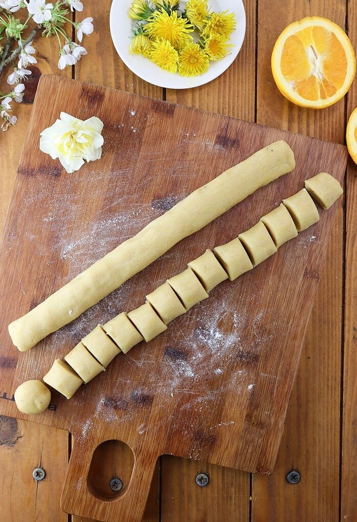 How to form two logs that will be sliced into even pieces to create balls of dough. 