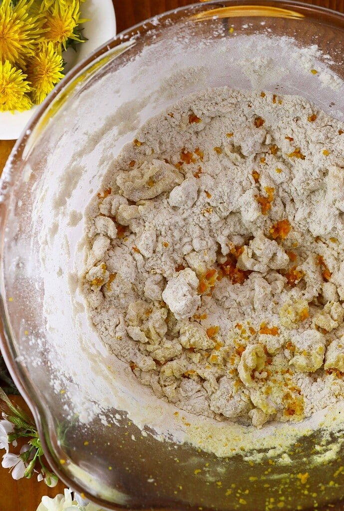 How to add the spelt flour and lemon zest to the cookie batter.