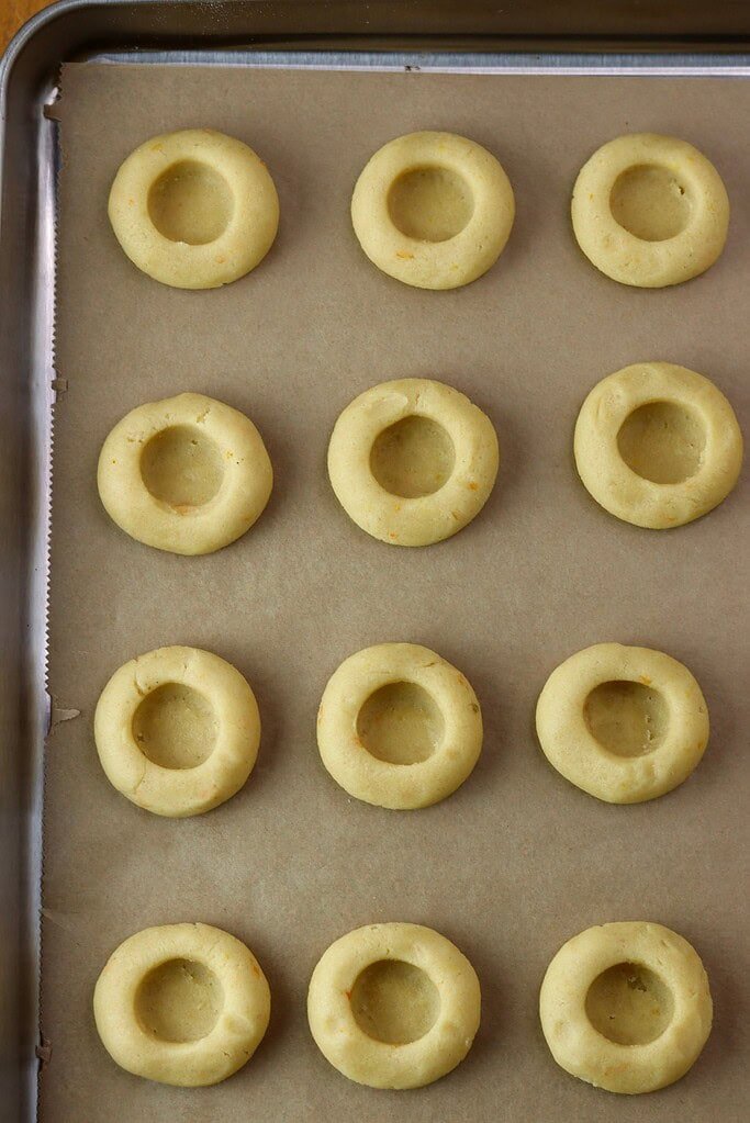 How to press down the balls and make an indentation for the filling.