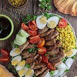Fried chicken of the woods mushroom salad recipe with corn, eggs, tomato, cucumber, onion and lamb's lettuce.
