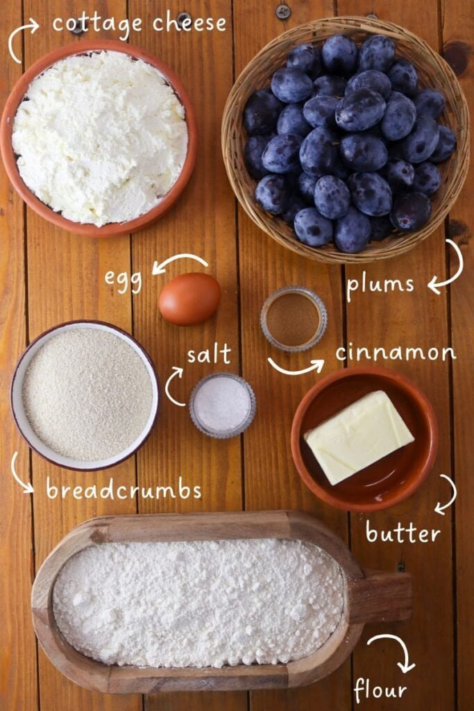Ingredients needed for dessert plum dumplings: spelt flour, cottage cheese, fresh plums, cinnamon, egg, salt, butter and breadcrumbs.