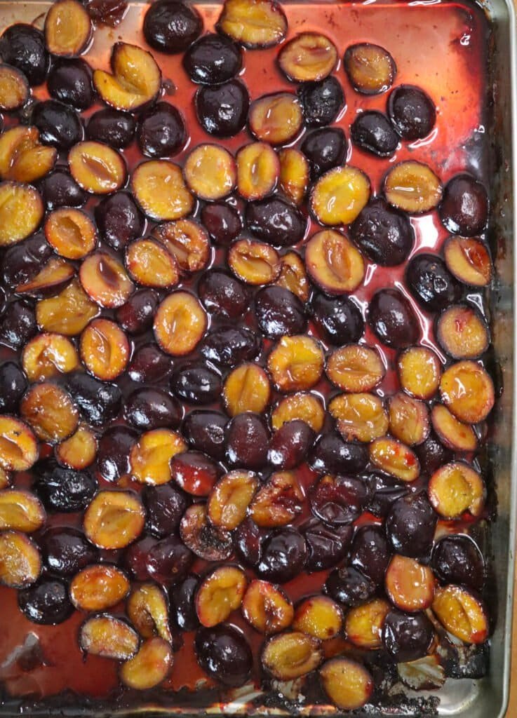 Half way roasted plums, ready to be turned around and roasted on the other side.