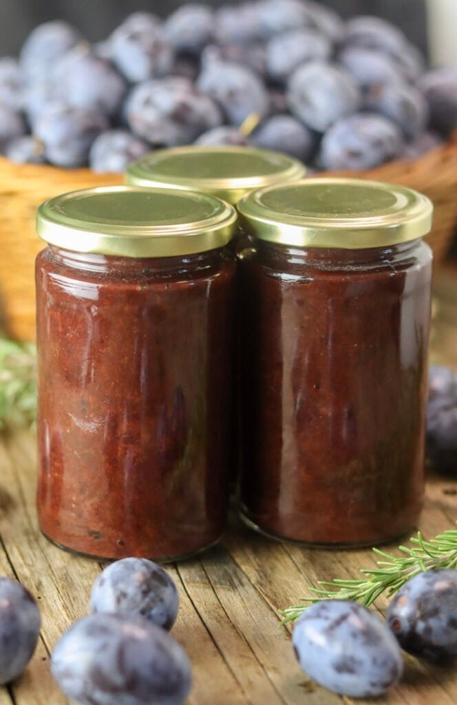 Three jars of canned sugar free plum jam, perfect for a low sugar pantry.