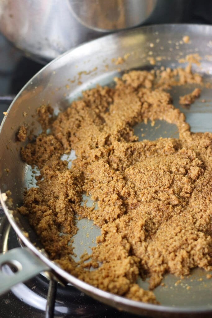 Toasting the breadcrumbs in a skillet with butter.