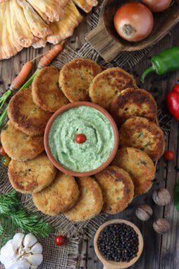 Delicious fried chicken of the woods mushroom fritters on a rustic table