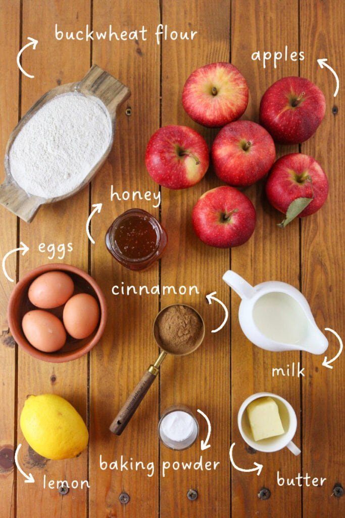 Ingredients needed for buckwheat apple cake: buckwheat flour, apples, eggs, honey, milk, butter, cinnamon, lemon and baking powder.