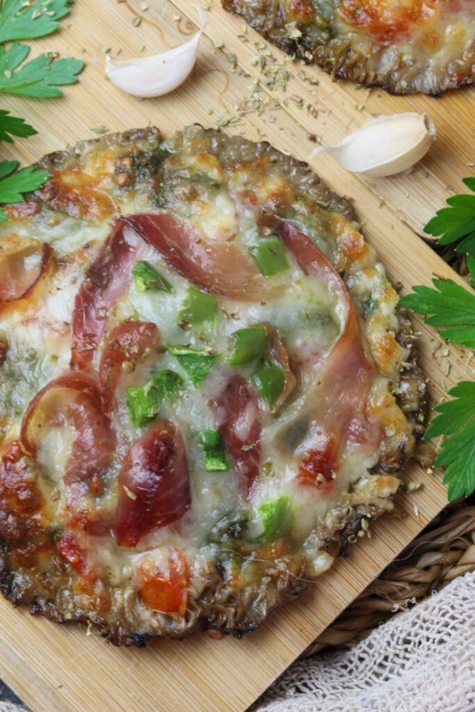 Delicious parasol mushroom pizza with garlic, prosciutto, pesto and mozarella.