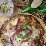 Delicious parasol mushroom pizza on a parasol mushroom crust, topped with tomato, pepper, mozzarella, pesto and prosciutto.