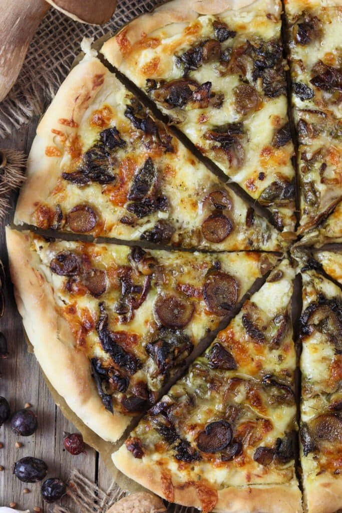 Large porcini pizza made by a delicious recipe with white sauce and two cheeses.