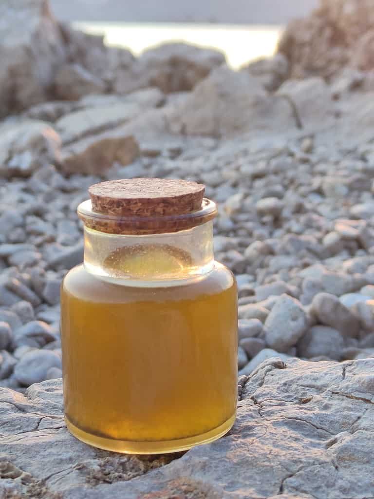 Image of a bottle of homemade helichrysum oil in Croatia