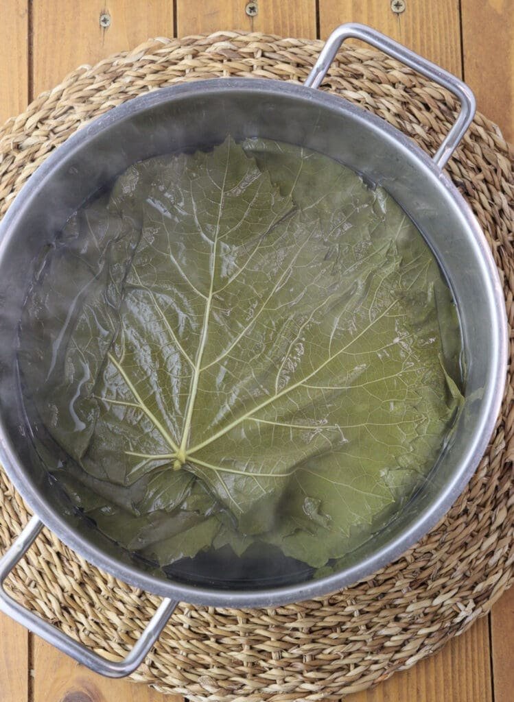 How to blanche young grape vine leaves.