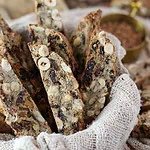 Crispy buckwheat biscotti arranged in a rustic basket