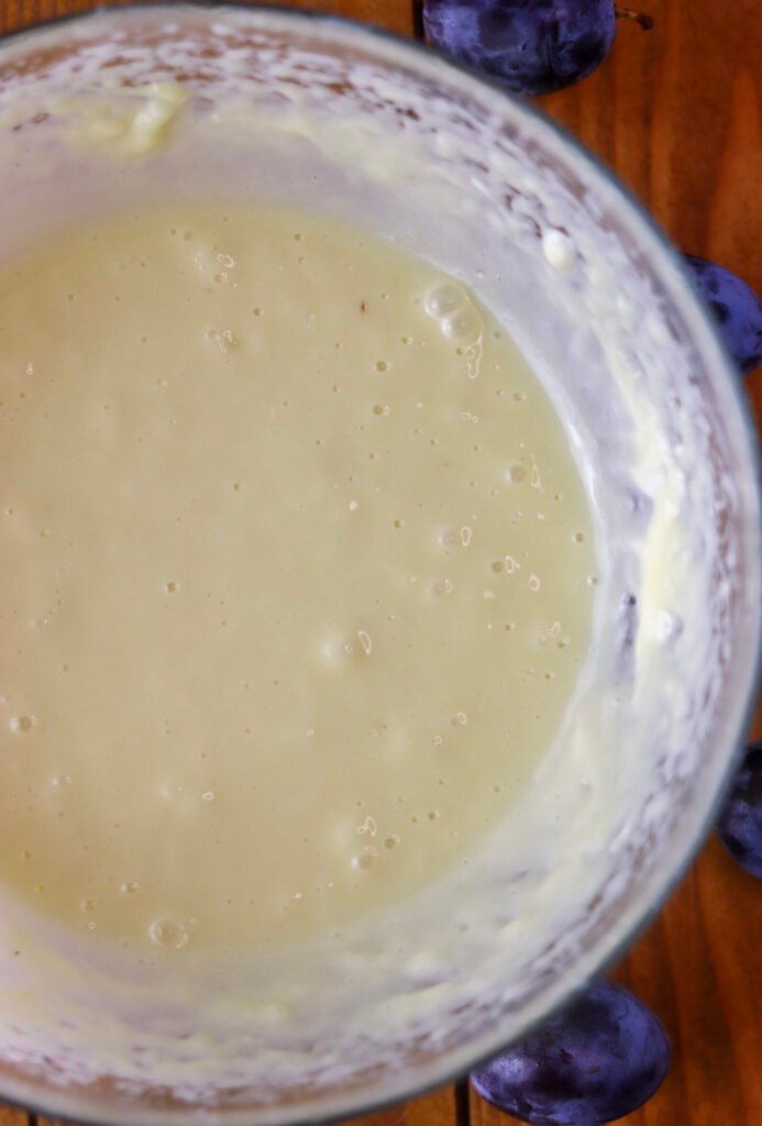 Mixing fresh cream cheese with melted white chocolate.